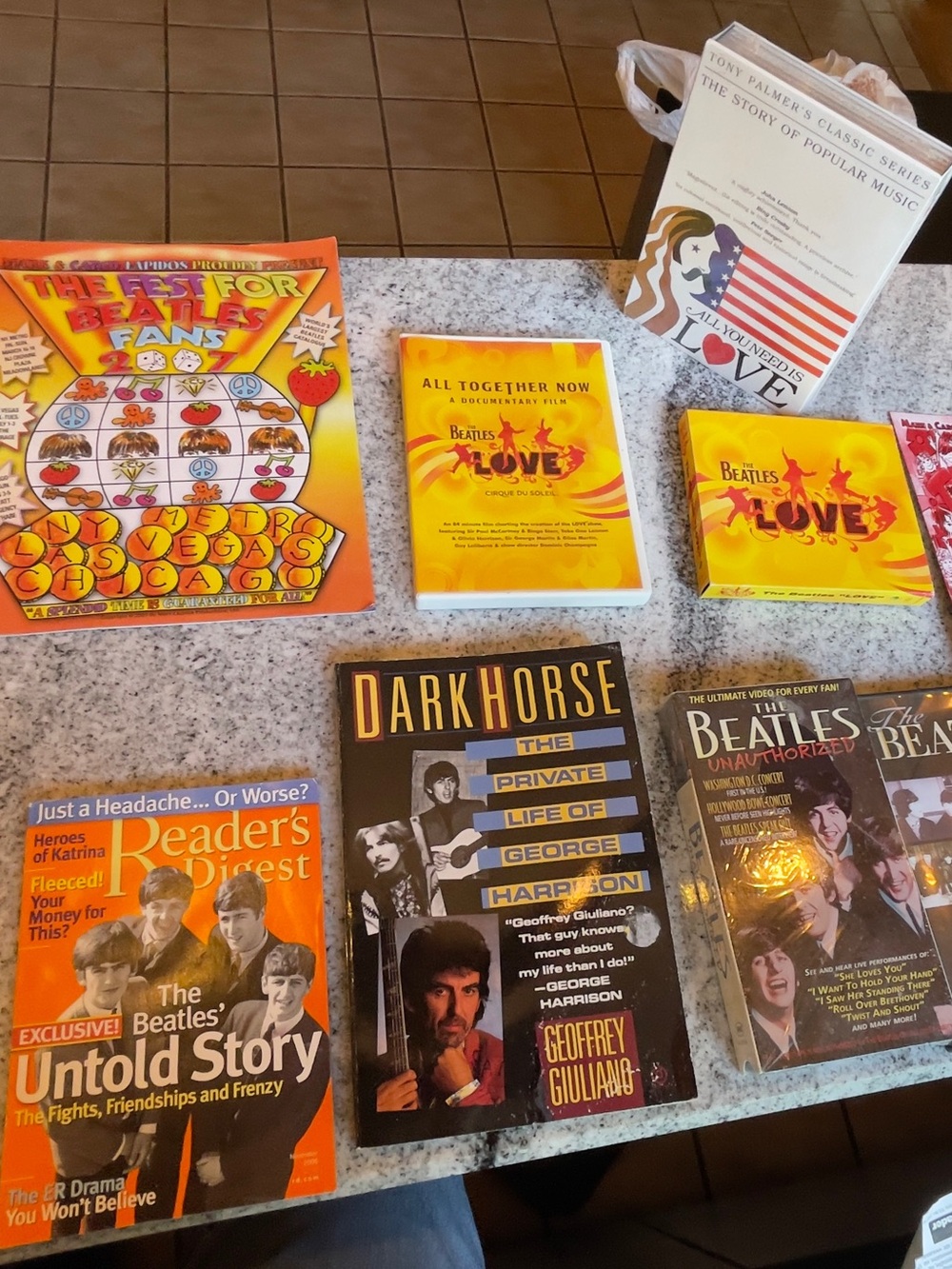 Lot Of Beatles Vintage VHS, DVD,
Magazine/Pamphlets, Book, Poster, Keychain!